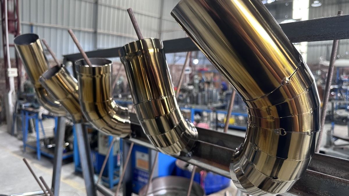 Titanium exhaust bends after TIG welding and finishing