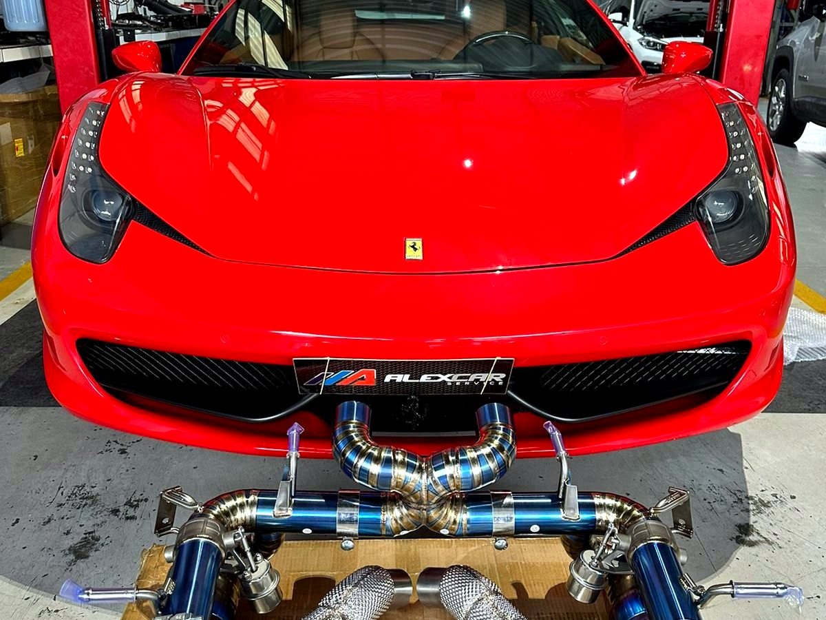 Ferrari 458 Italia with full OUCHI titanium exhaust and downpipe kit laid out for installation — customer photo