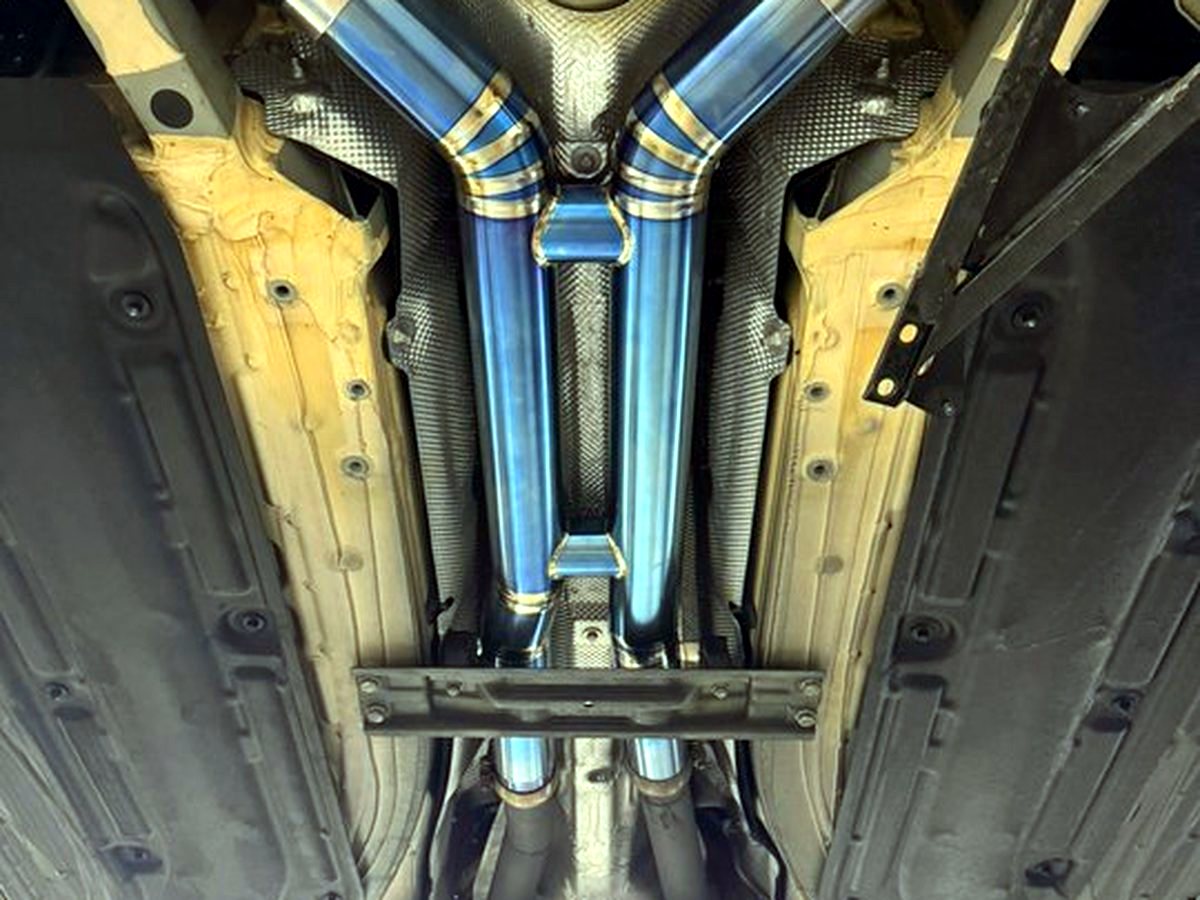 Mercedes-AMG GT S underbody with OUCHI straight-piped titanium mid-rear exhaust — customer installation