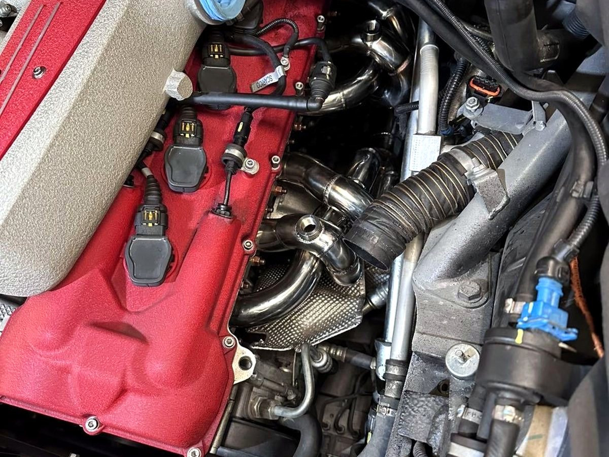 Ferrari 599 GTB V12 with OUCHI header being installed — customer photo