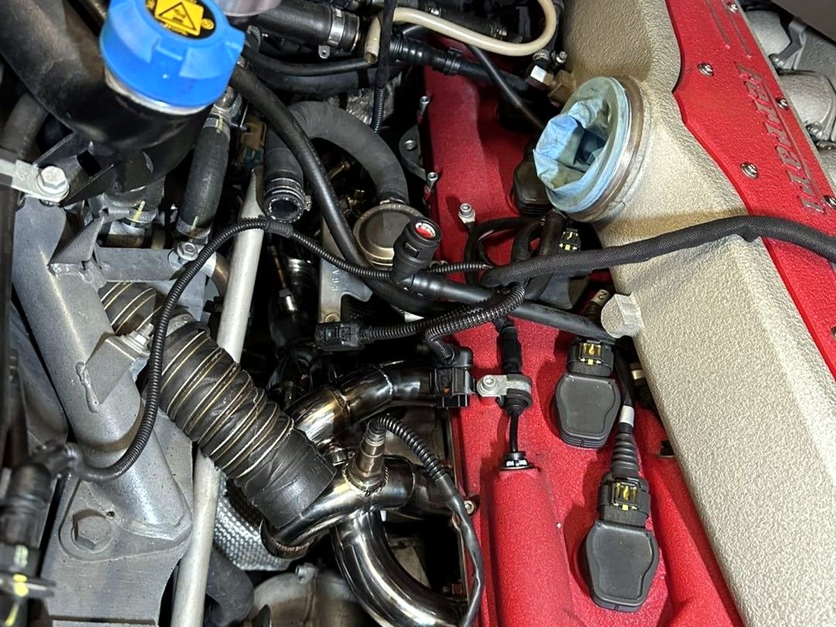 Ferrari 599 GTB header installation in the engine bay — customer photo