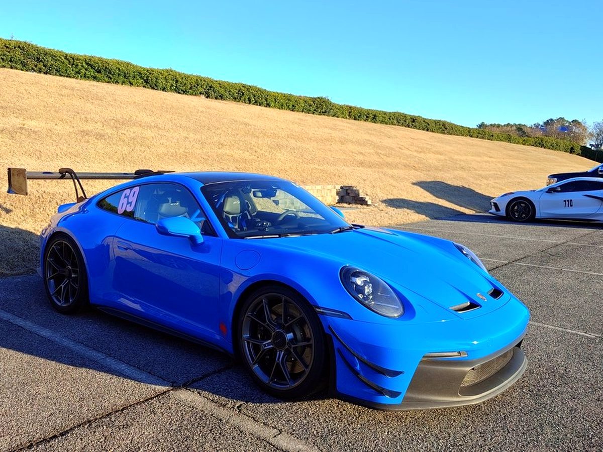 Porsche 992 GT3 at a track day, OUCHI exhaust fitted — customer photo