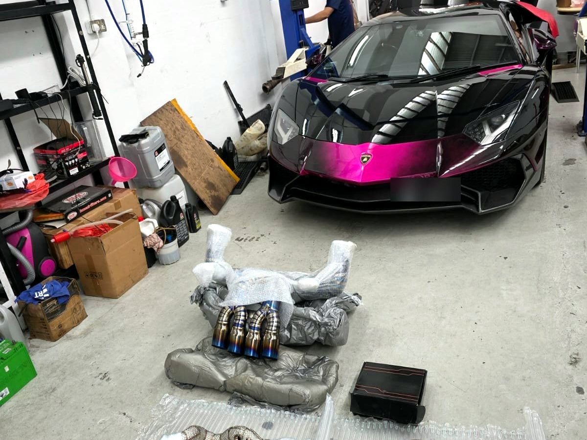 Lamborghini Aventador LP700 — OUCHI equal-length header and titanium valved exhaust kit unboxed next to the car — customer installation
