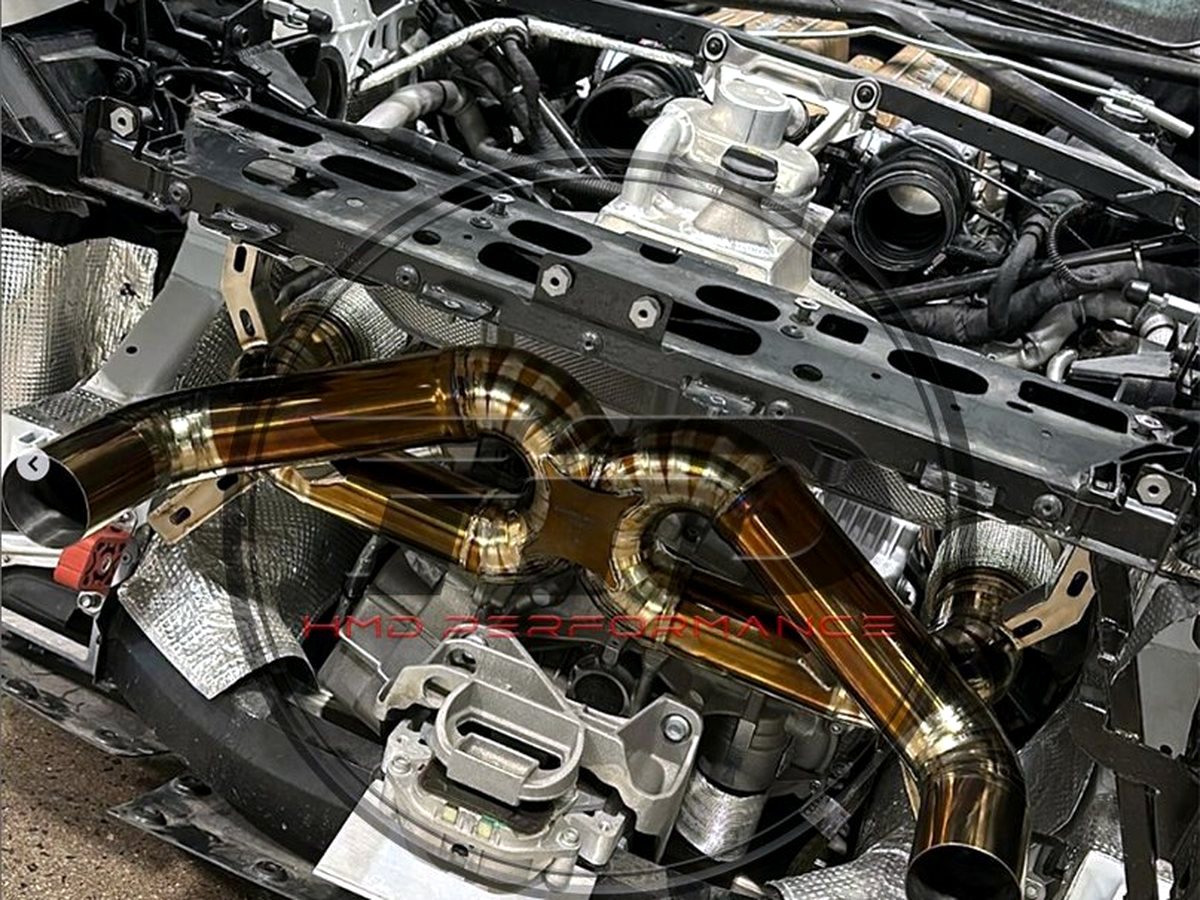 Lamborghini Huracan STO V10 bay with OUCHI titanium X-pipe exhaust fitted — customer installation