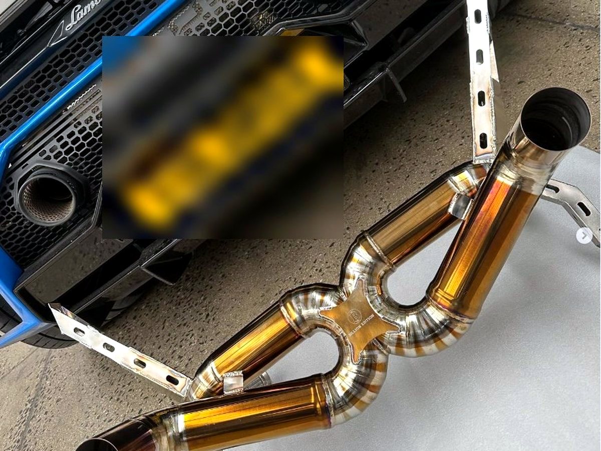 Lamborghini Huracan STO with OUCHI titanium X-pipe in front of the rear bumper — customer installation