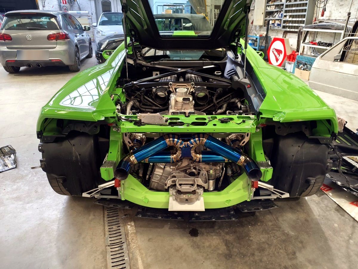 Lamborghini Huracan Tecnica engine bay from above with OUCHI titanium exhaust fitted — customer installation