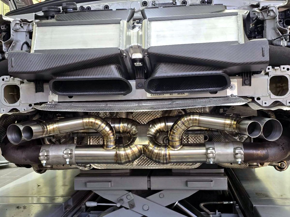 Porsche 992 3.0T titanium valved exhaust, heat-tinted — customer installation