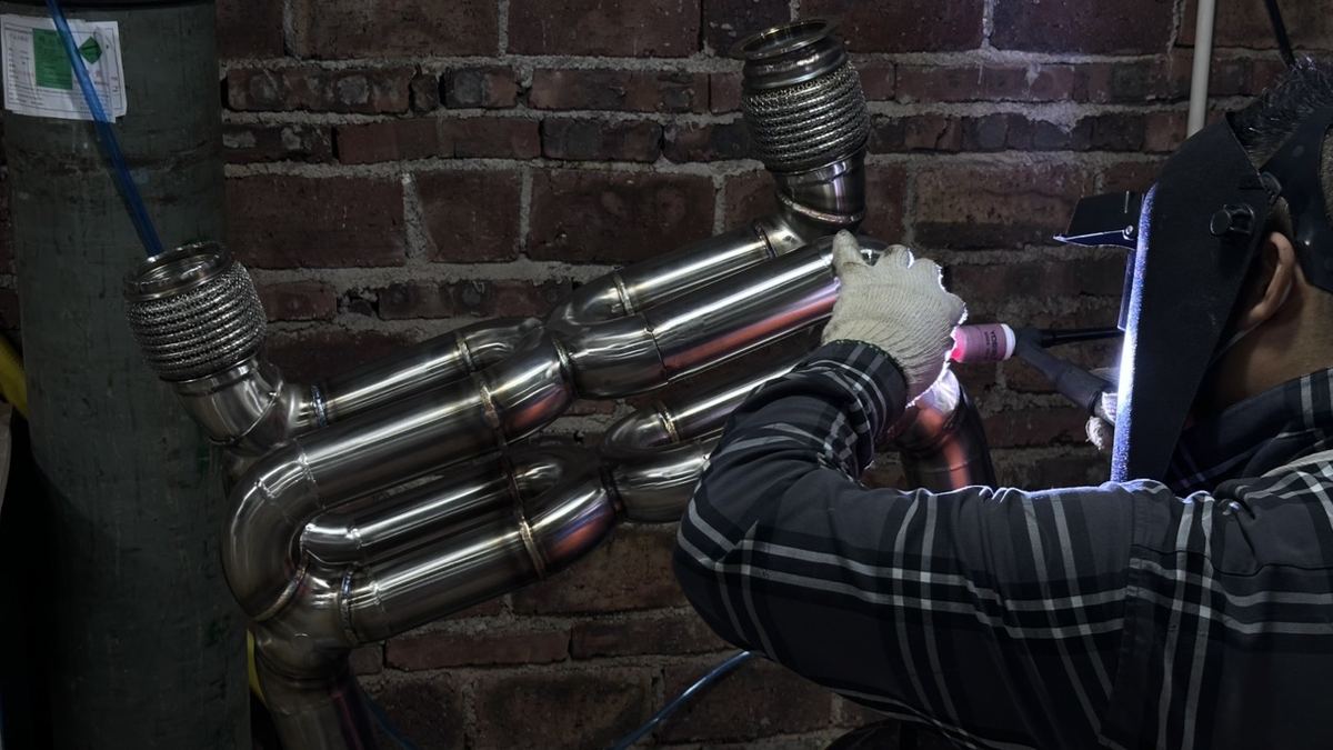 Hand TIG welding a stainless steel exhaust header