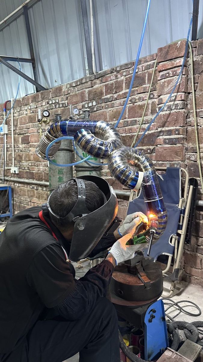 Welder performing a back-purged TIG weld on titanium tubing