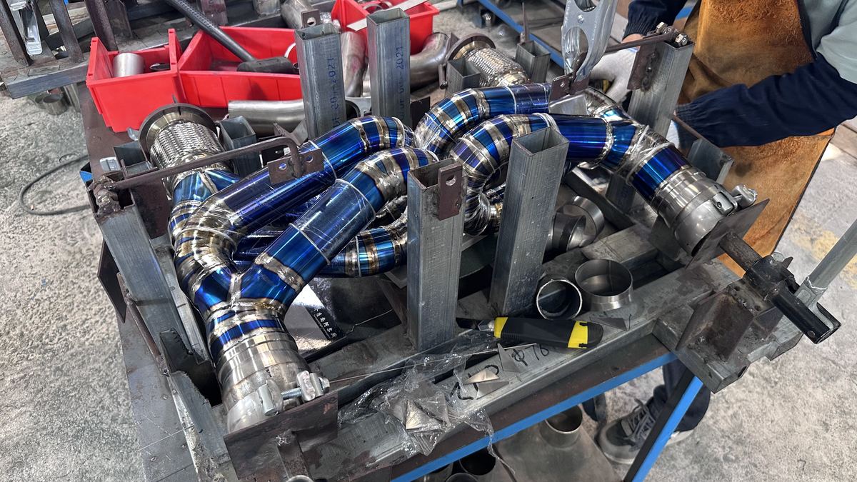 Titanium 911 header tacked in the welding jig